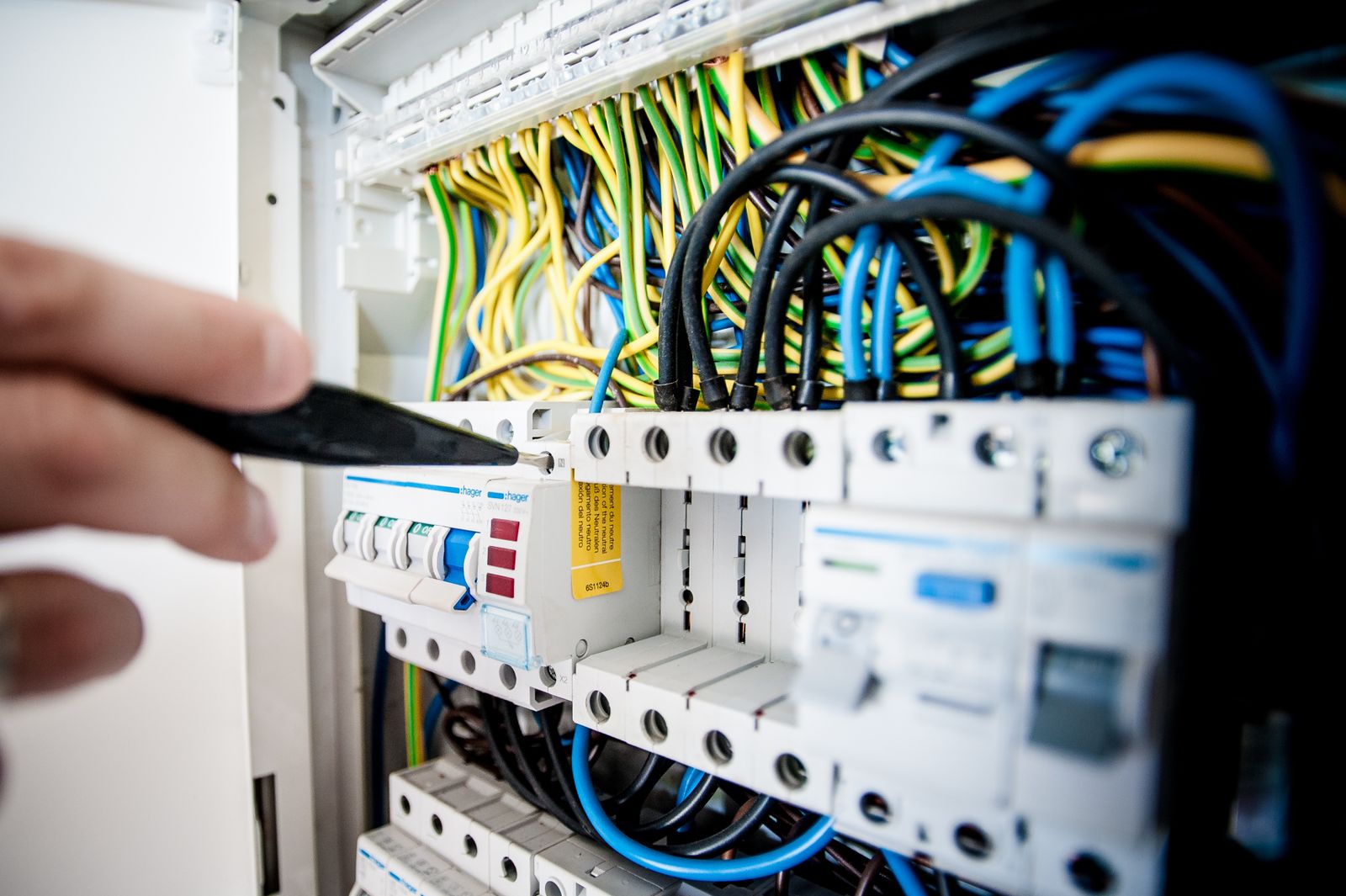 Electrician upgrading a distribution board